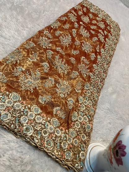 Goud bruine sareestof met gouden steentjes